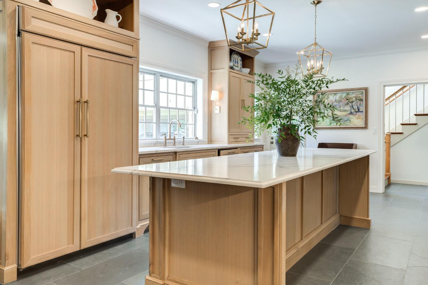 4909 19th Street Lubbock, TX 79407 - Photo 19 of 50 a dining table with a chandelier