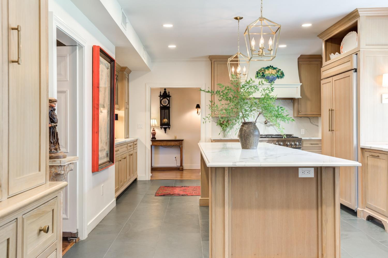 4909 19th Street Lubbock, TX 79407 - Photo 21 of 50 a kitchen with stainless steel appliances kitchen island granite countertop a refrigerator and a sink