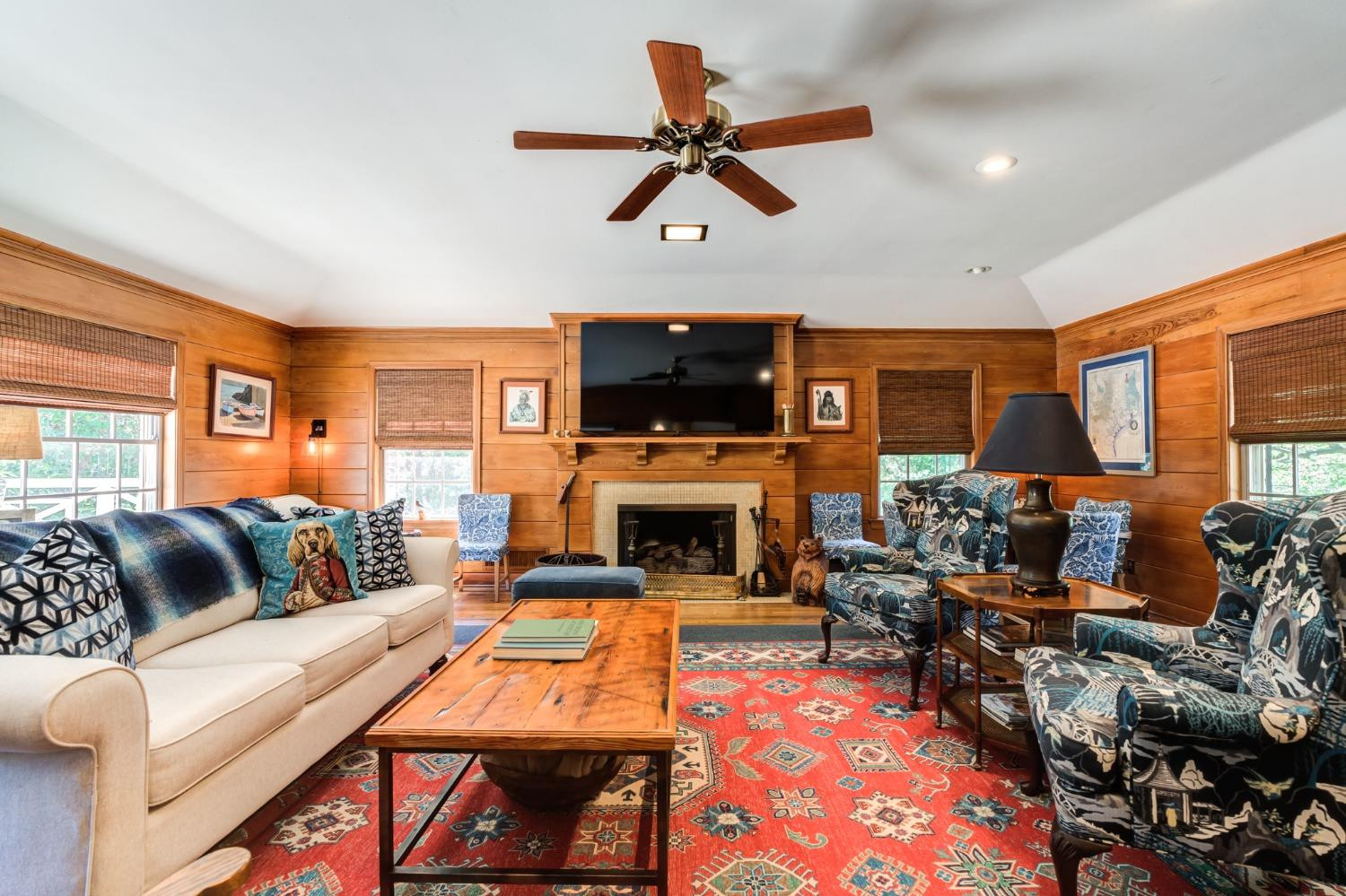 4909 19th Street Lubbock, TX 79407 - Photo 26 of 50 a living room with furniture a flat screen tv and a fireplace