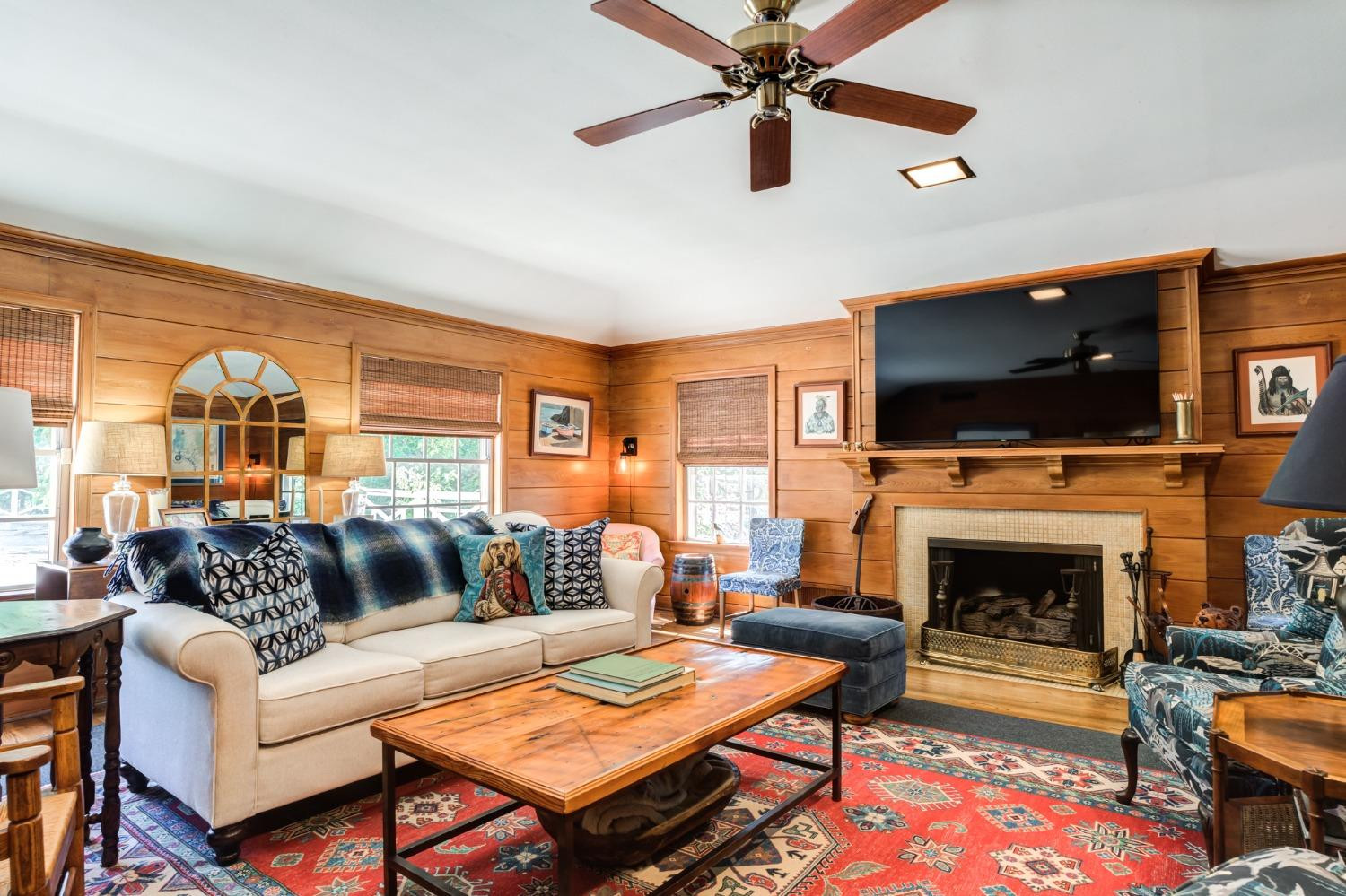 4909 19th Street Lubbock, TX 79407 - Photo 27 of 50 a living room with furniture a flat screen tv and a fireplace
