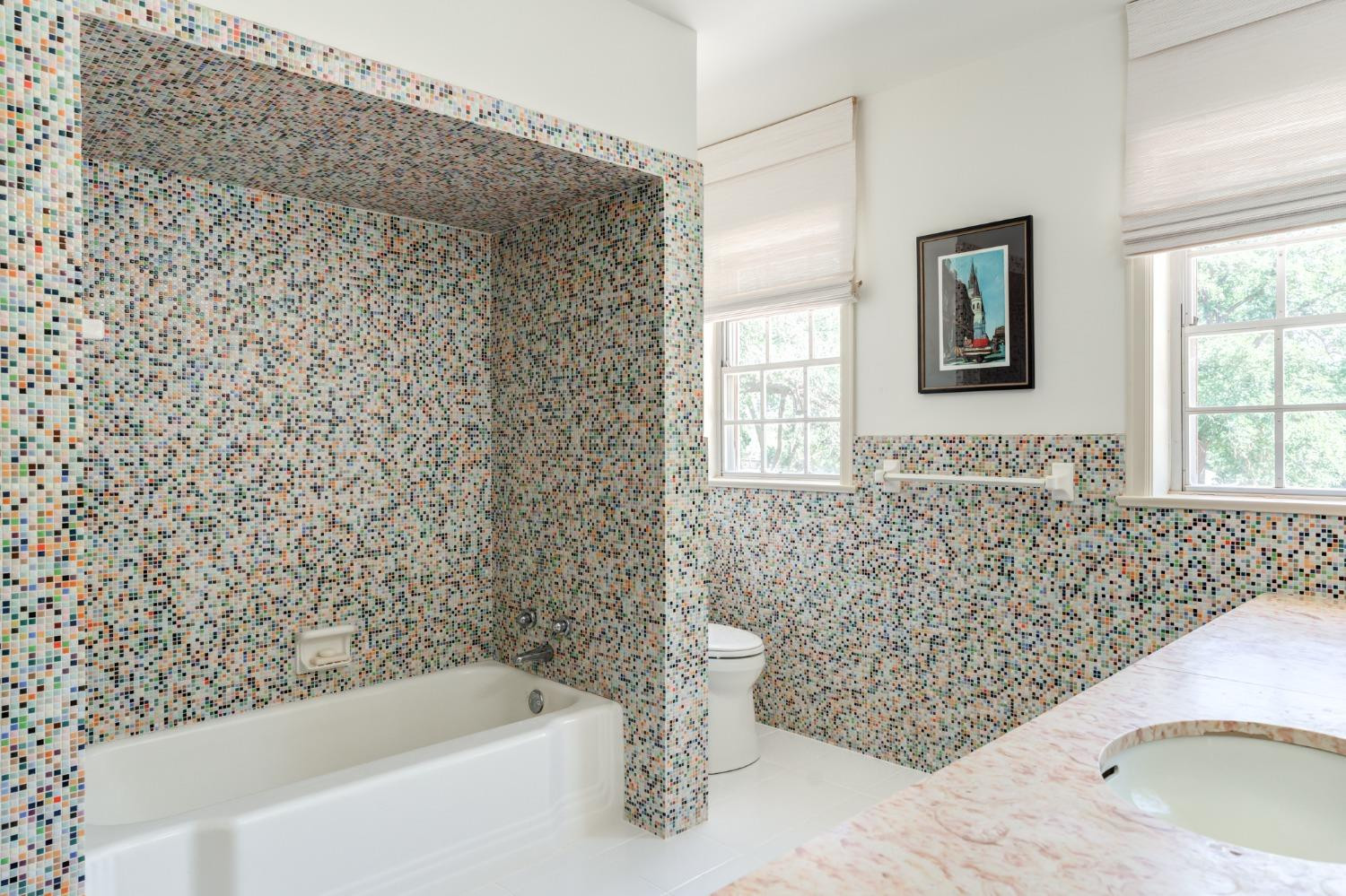 4909 19th Street Lubbock, TX 79407 - Photo 29 of 50 a bathroom with a bathtub and window