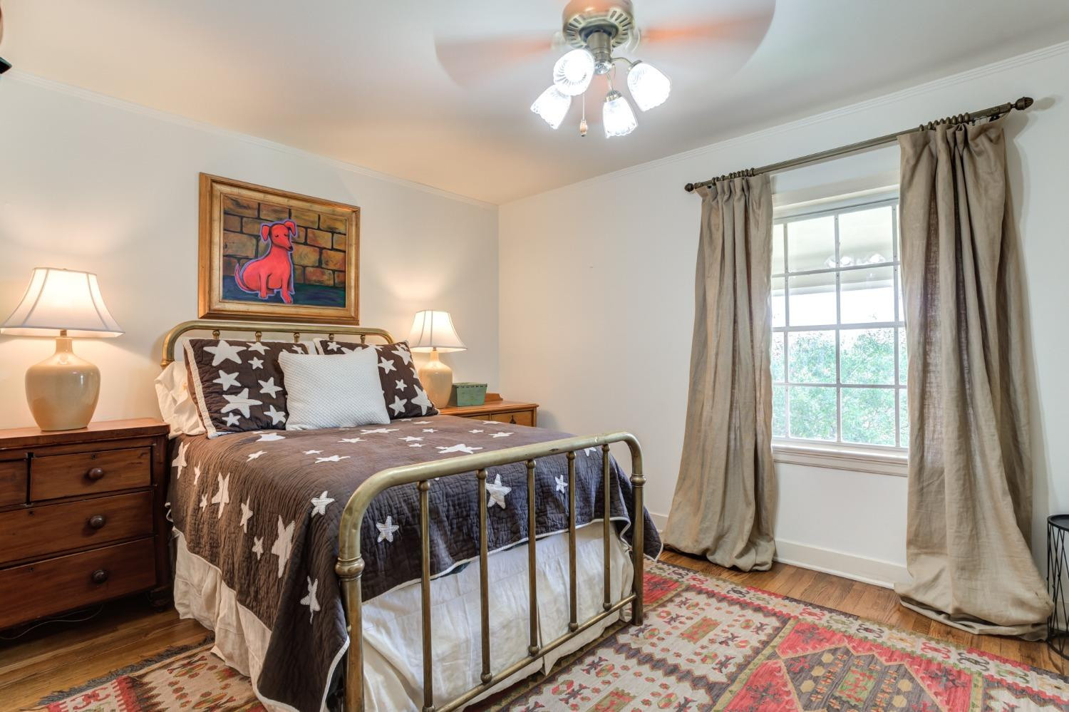 4909 19th Street Lubbock, TX 79407 - Photo 30 of 50 a bedroom with a bed and a window