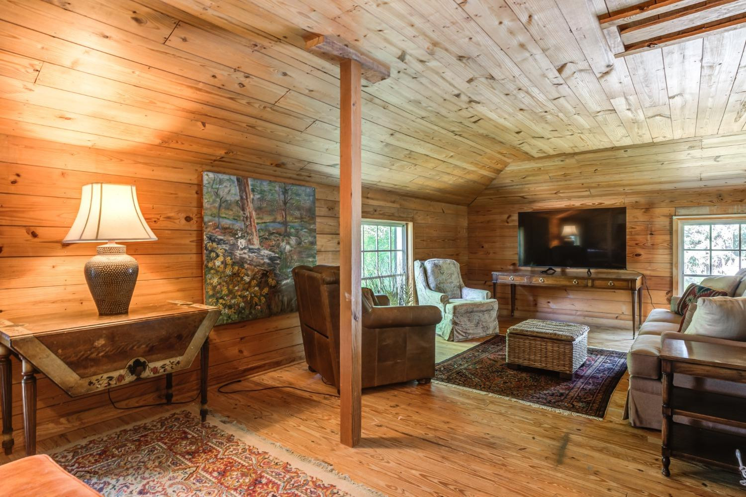 4909 19th Street Lubbock, TX 79407 - Photo 35 of 50 a living room with furniture a flat screen tv and a fireplace