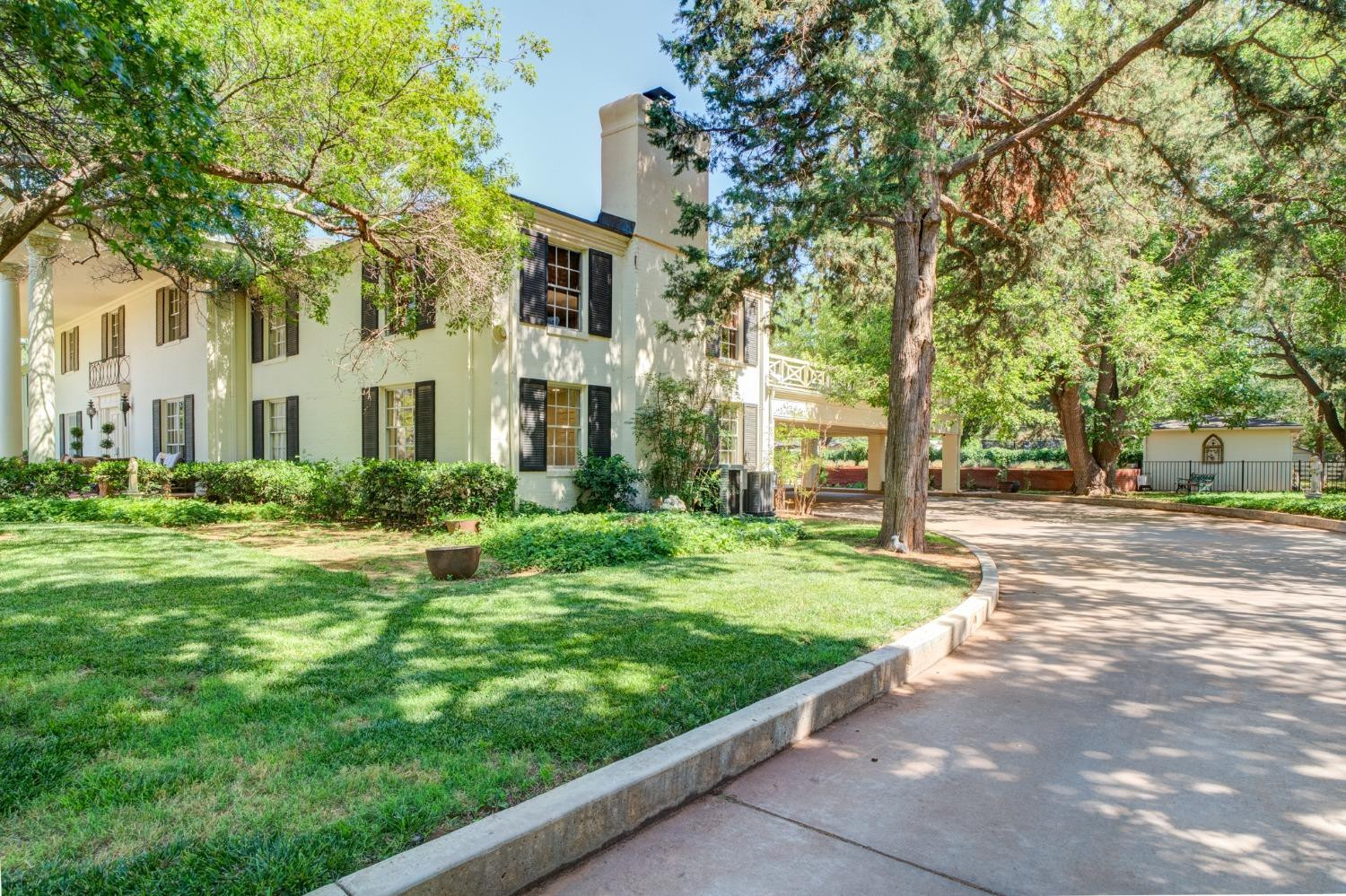 4909 19th Street Lubbock, TX 79407 - Photo 4 of 50 a front view of a house with a yard