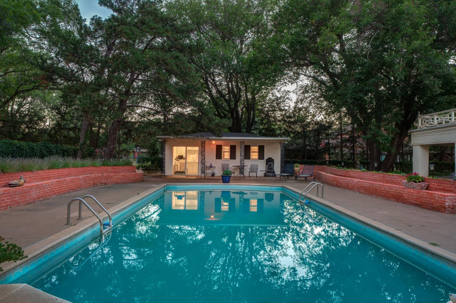 4909 19th Street Lubbock, TX 79407 - Photo 42 of 50 a view of a house with swimming pool and sitting area