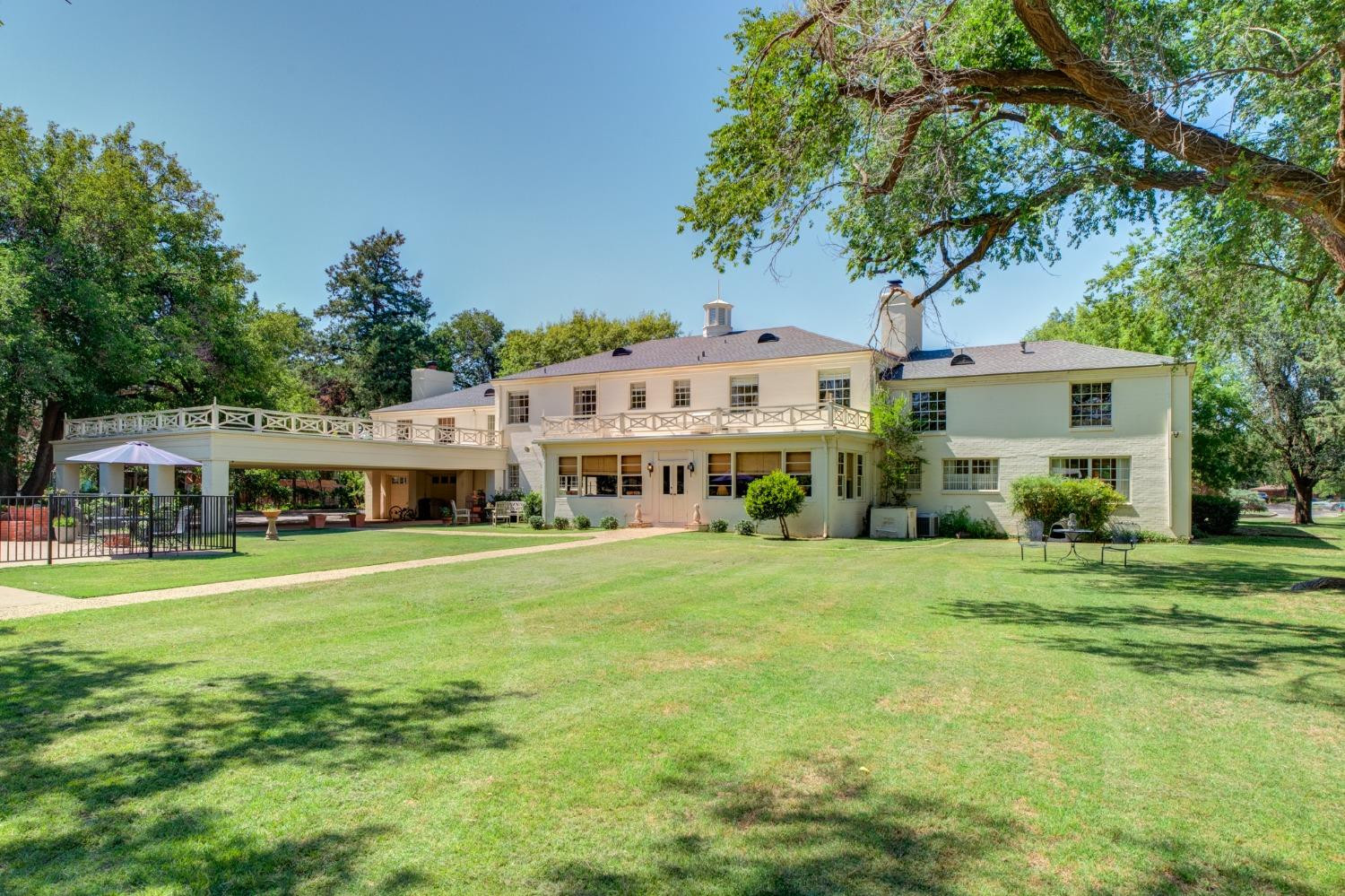 4909 19th Street Lubbock, TX 79407 - Photo 48 of 50 a view of a house with a big yard plants and large trees