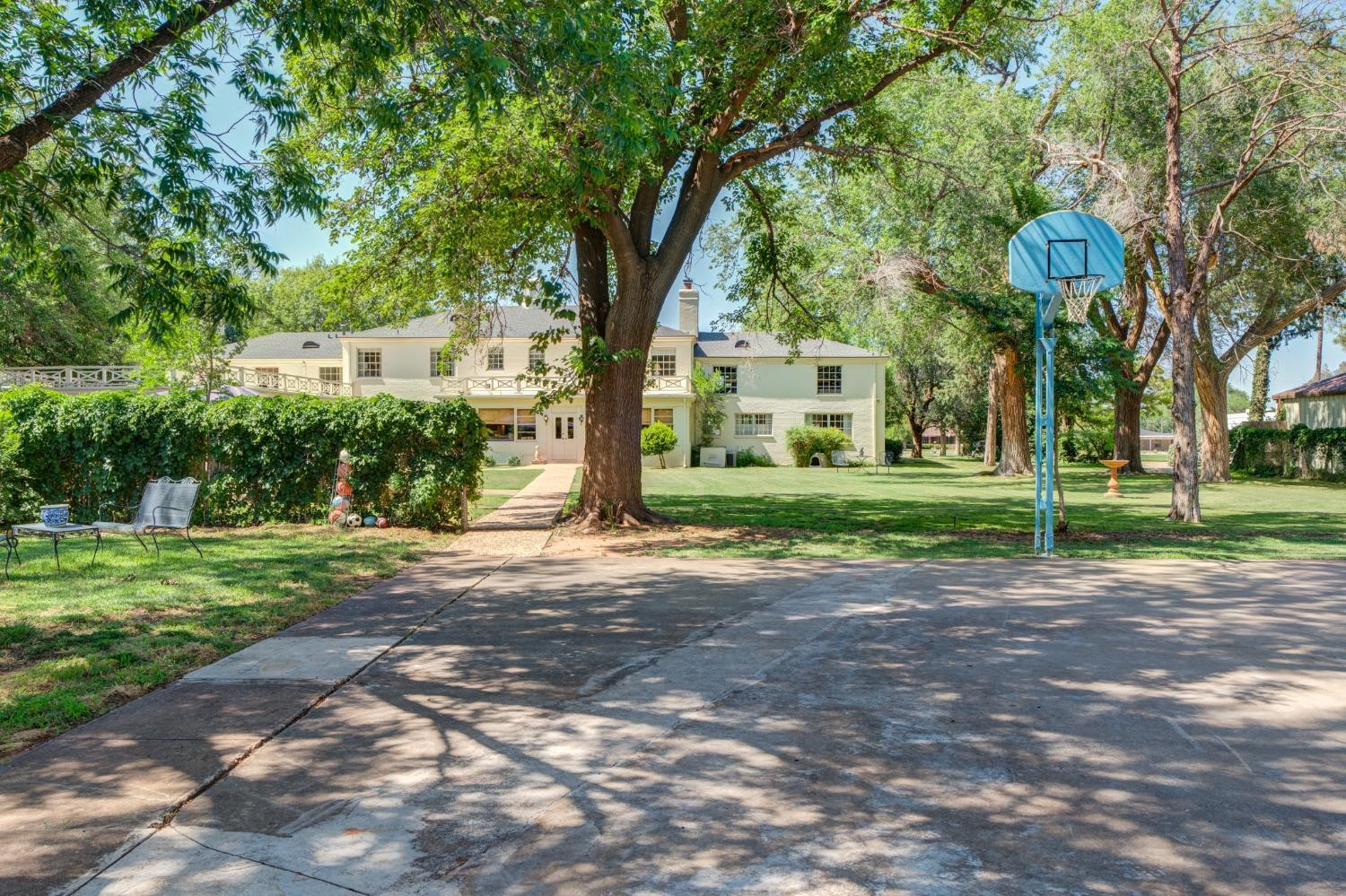 4909 19th Street Lubbock, TX 79407 - Photo 50 of 50 a view of a yard with plants and trees