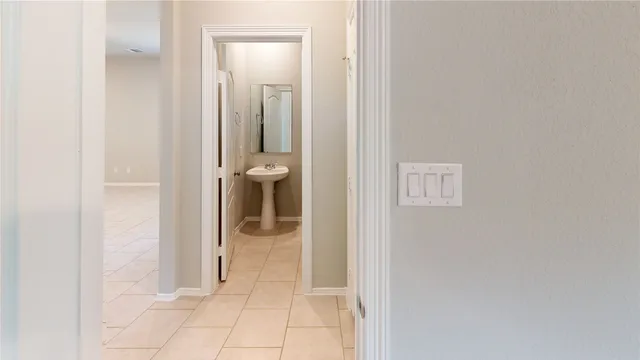 a bathroom with a glass door shower