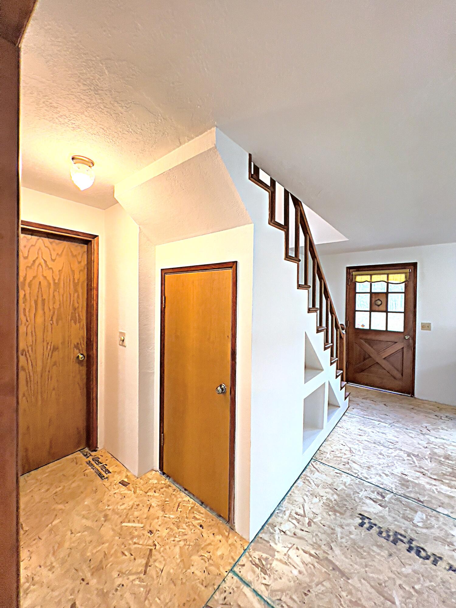 5407 Tunnel Loop Road Grants Pass, OR 97526 - Photo 7 of 19 Storage Closet under Stairs; Interior Access Door from Garage