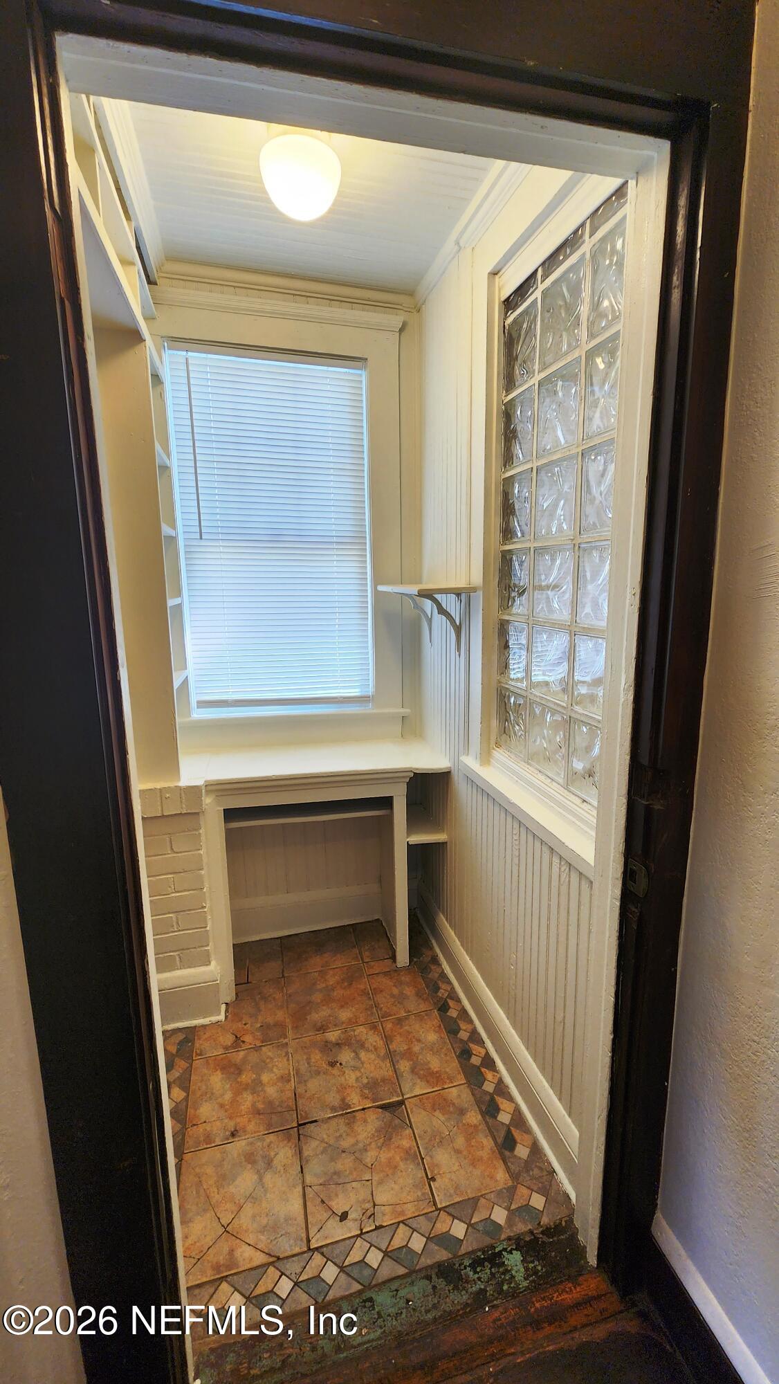 2036 Moncrief Road Jacksonville, FL 32209 - Photo 10 of 32 a view of entryway with wooden floor and door