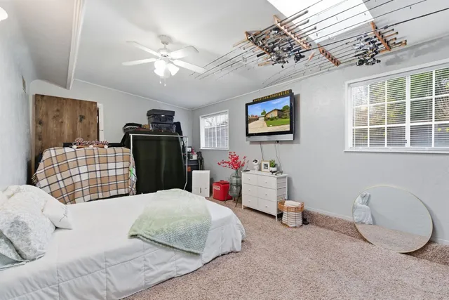 a bedroom with a bed and a couch