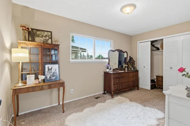 a bathroom with a sink mirror and toilet