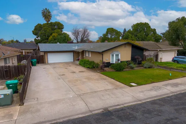 an aerial view of a house with a outdoor space