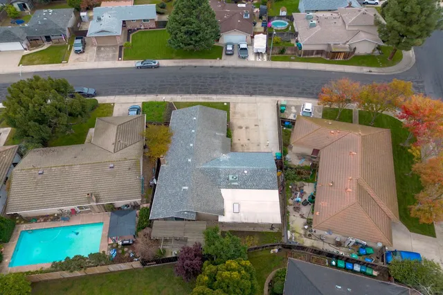 an aerial view of residential houses with outdoor space