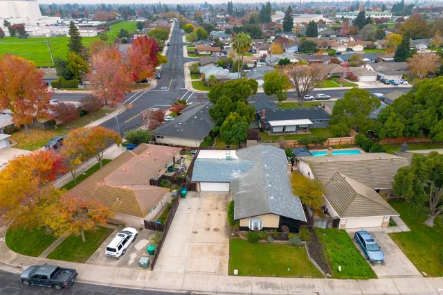 an aerial view of residential houses with outdoor space
