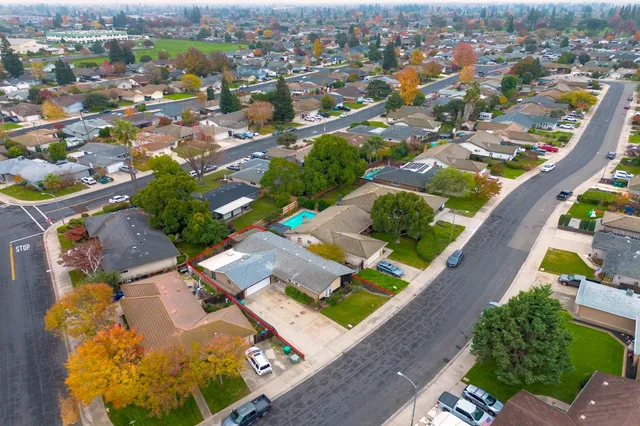 an aerial view of a house with a garden