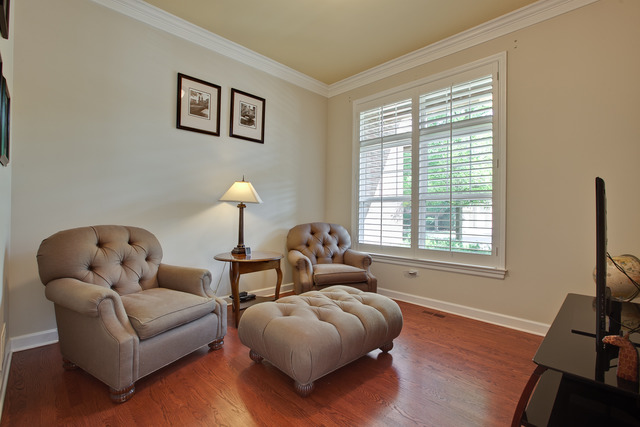 502 South Commons Court, Unit 502 Deerfield, IL 60015 - Photo 12 of 33 a living room with furniture and a flat screen tv
