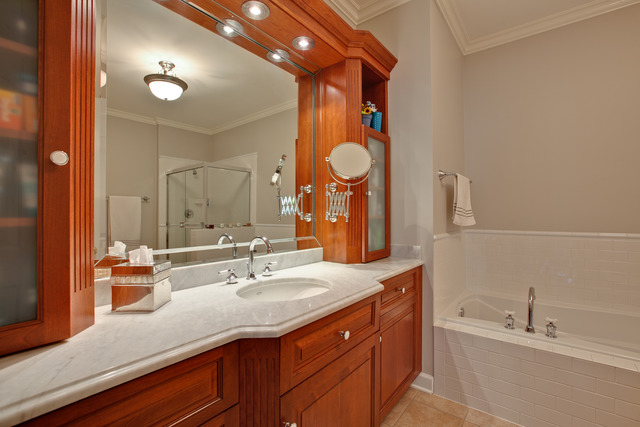 502 South Commons Court, Unit 502 Deerfield, IL 60015 - Photo 14 of 33 a bathroom with a granite countertop sink and a mirror