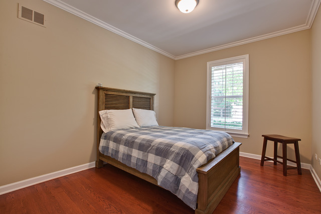 502 South Commons Court, Unit 502 Deerfield, IL 60015 - Photo 15 of 33 a bed sitting in a bedroom next to a window