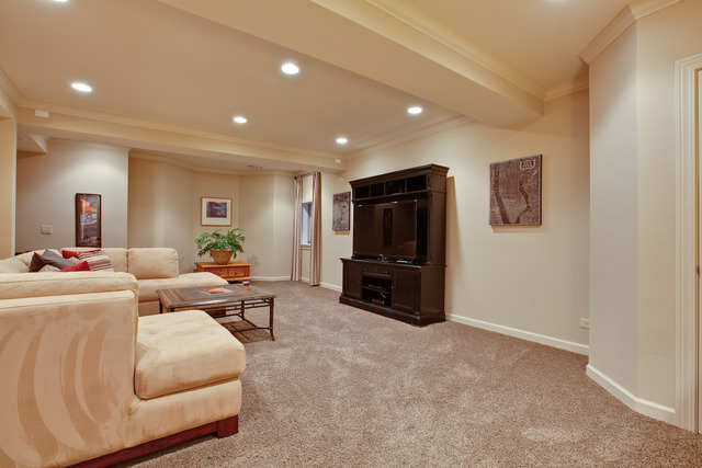 502 South Commons Court, Unit 502 Deerfield, IL 60015 - Photo 18 of 33 a living room with furniture and a flat screen tv