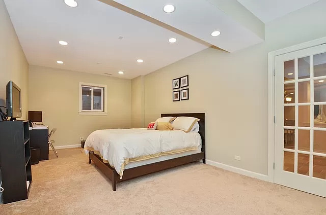 502 South Commons Court, Unit 502 Deerfield, IL 60015 - Photo 23 of 33 a spacious bedroom with a bed and a window