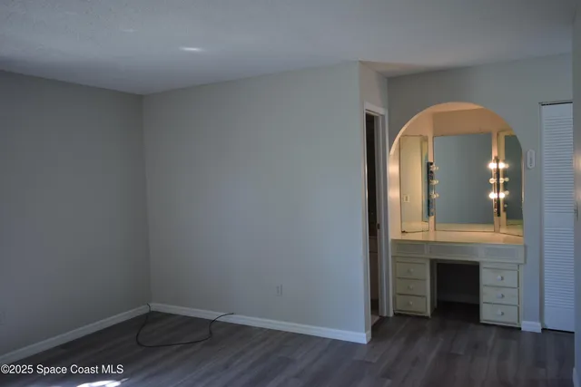 a view of a livingroom with wooden floor