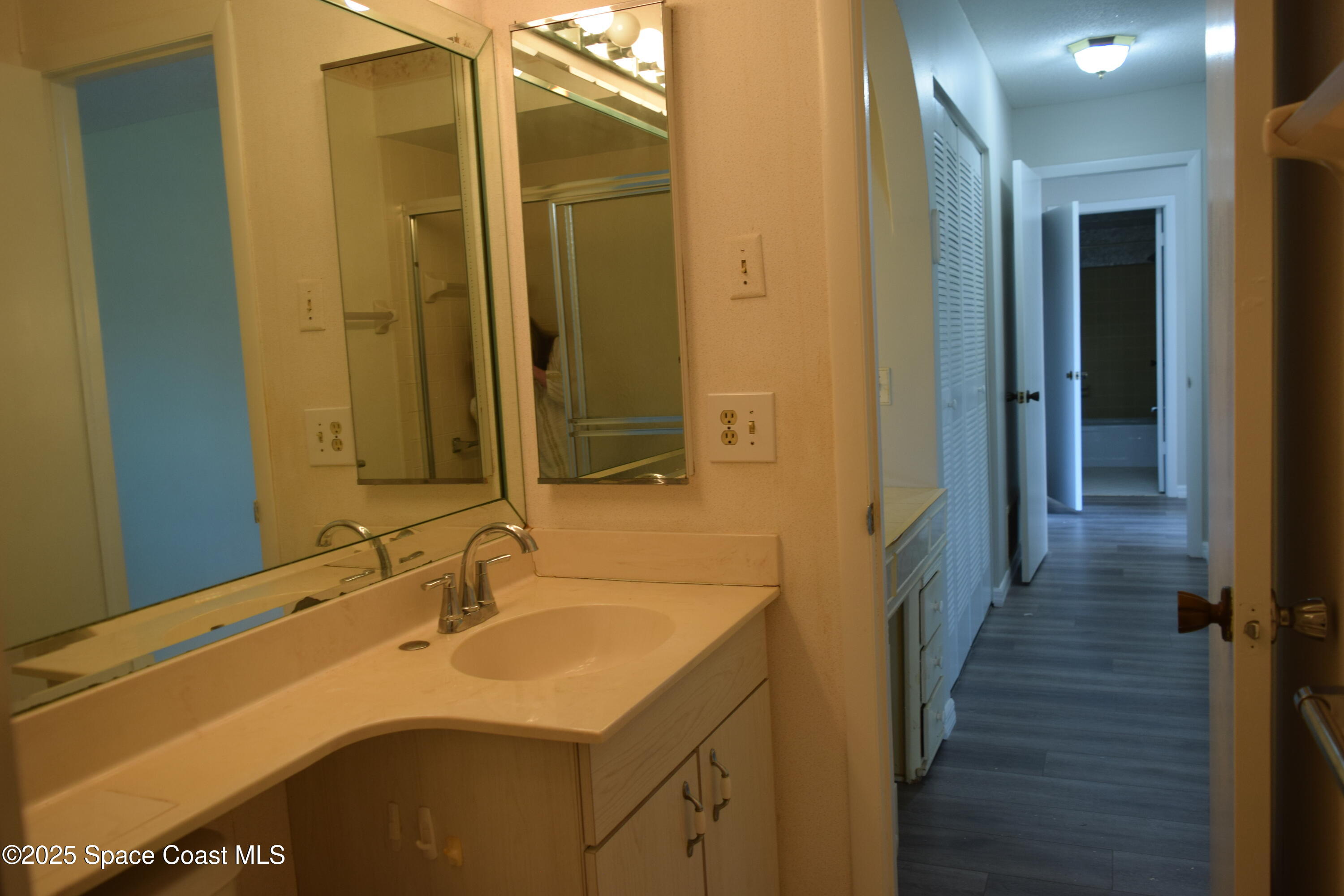 2696 Yalta Street Northeast Palm Bay, FL 32905 - Photo 17 of 28 a bathroom with a sink and a mirror