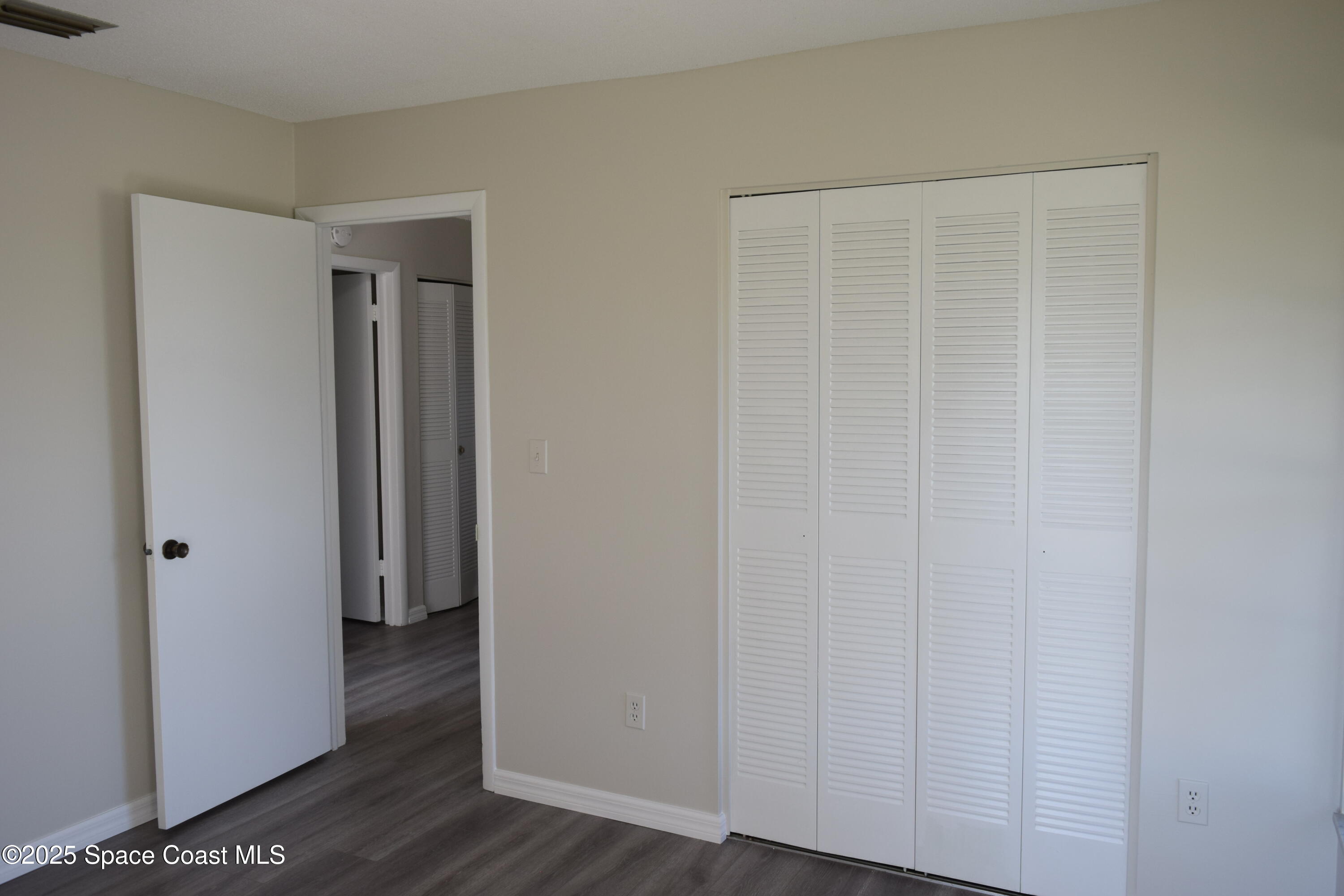 2696 Yalta Street Northeast Palm Bay, FL 32905 - Photo 19 of 28 a view of a room with wooden floor