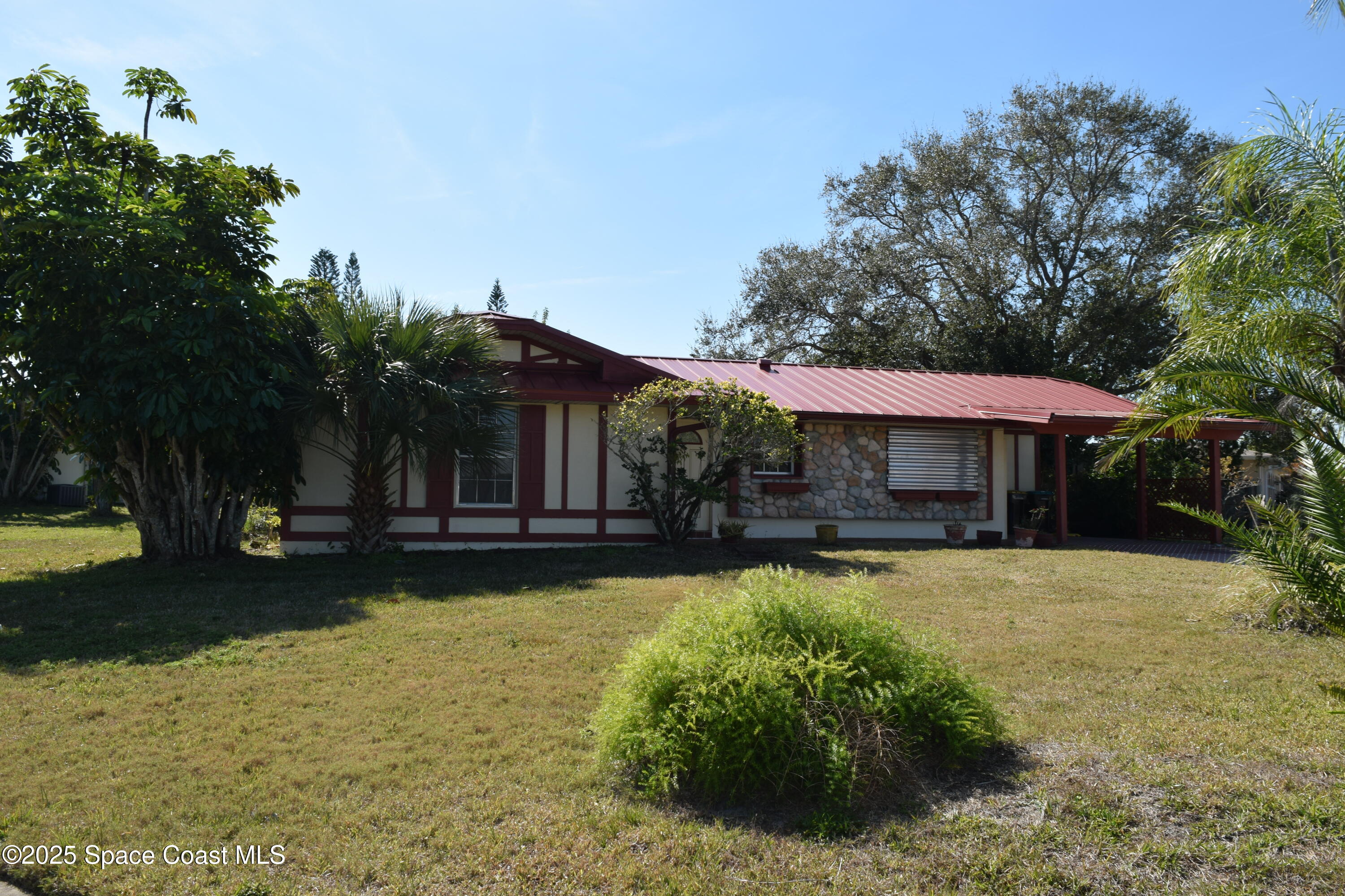 2696 Yalta Street Northeast Palm Bay, FL 32905 - Photo 2 of 28 a view of a house with swimming pool next to a yard