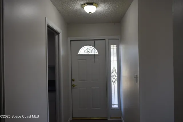 a view of a hallway with windows