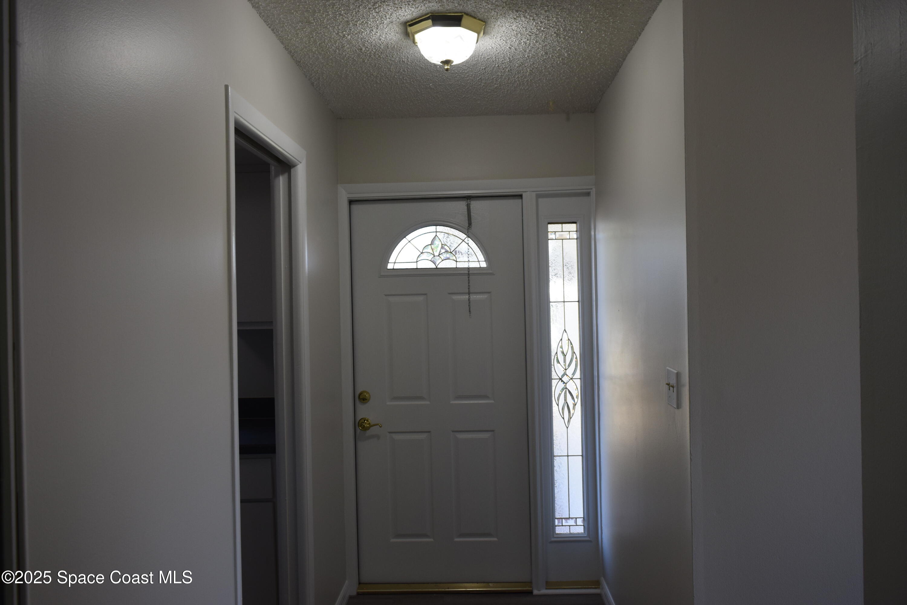 2696 Yalta Street Northeast Palm Bay, FL 32905 - Photo 3 of 28 a view of a hallway with windows