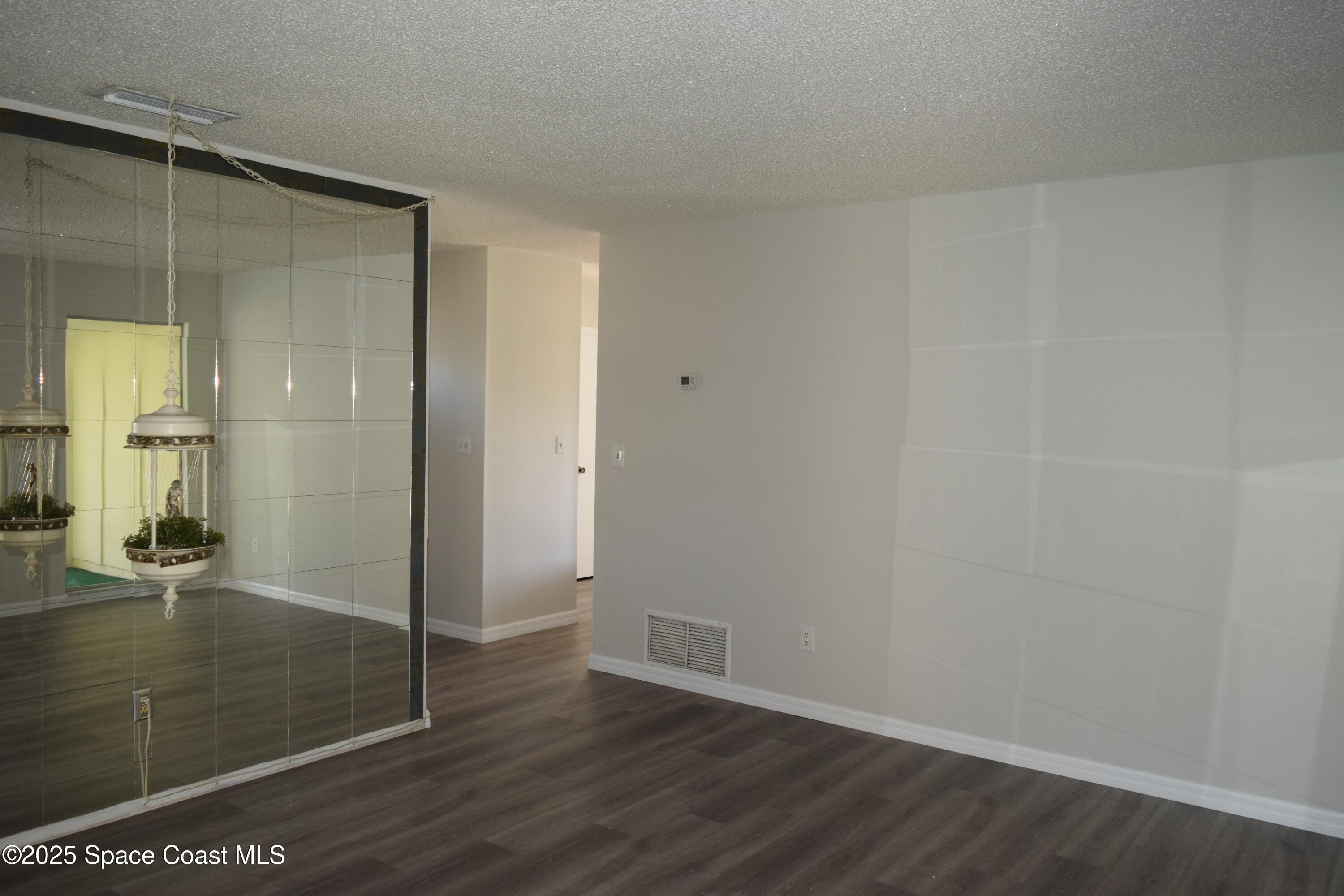 2696 Yalta Street Northeast Palm Bay, FL 32905 - Photo 5 of 28 wooden floor in an empty room