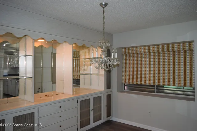 a bathroom with a double vanity sink and mirror