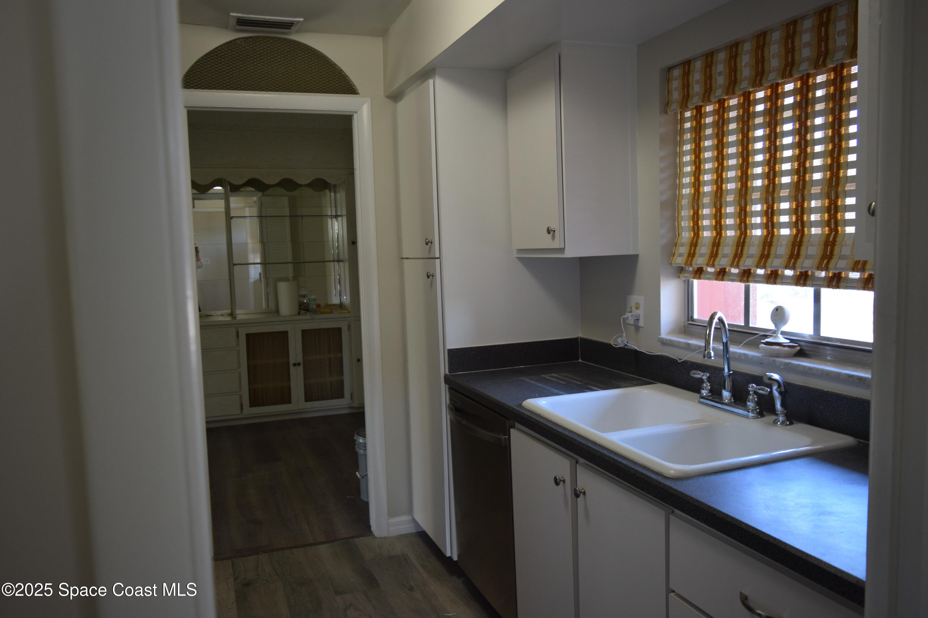 2696 Yalta Street Northeast Palm Bay, FL 32905 - Photo 9 of 28 a kitchen with a sink and cabinets