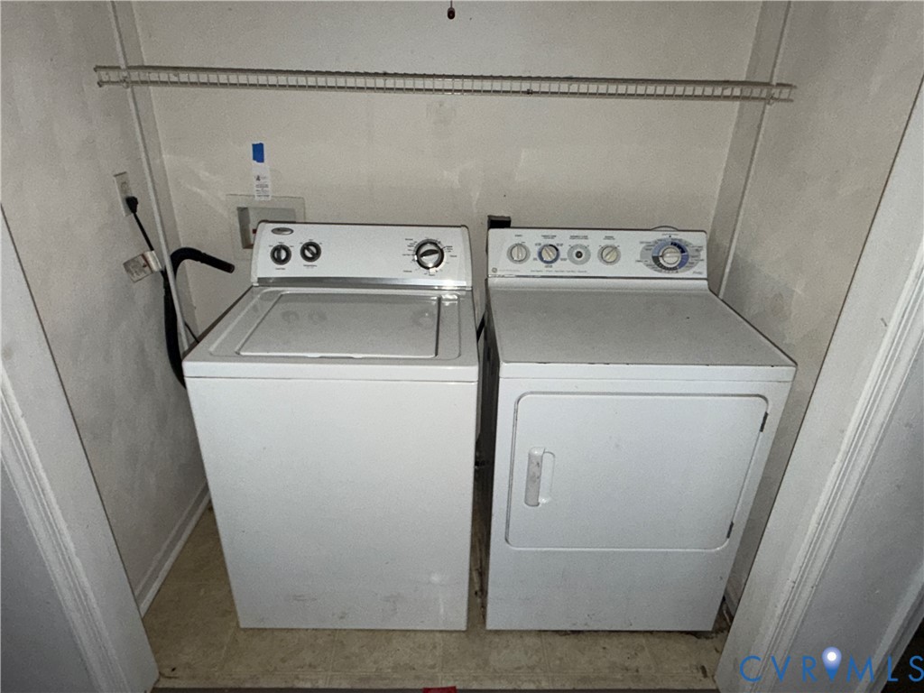117 Pleasant Spring Avenue Waverly, VA 23890 - Photo 10 of 12 a utility room with dryer and washer
