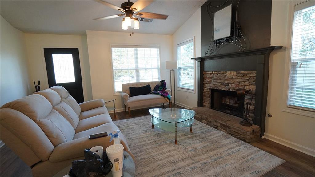 138 West Fork Way Temple, GA 30179 - Photo 5 of 21 a living room with furniture and a fireplace