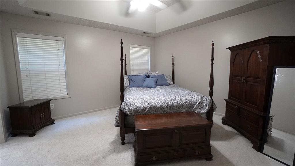 138 West Fork Way Temple, GA 30179 - Photo 7 of 21 a bedroom with a bed a dresser and a window