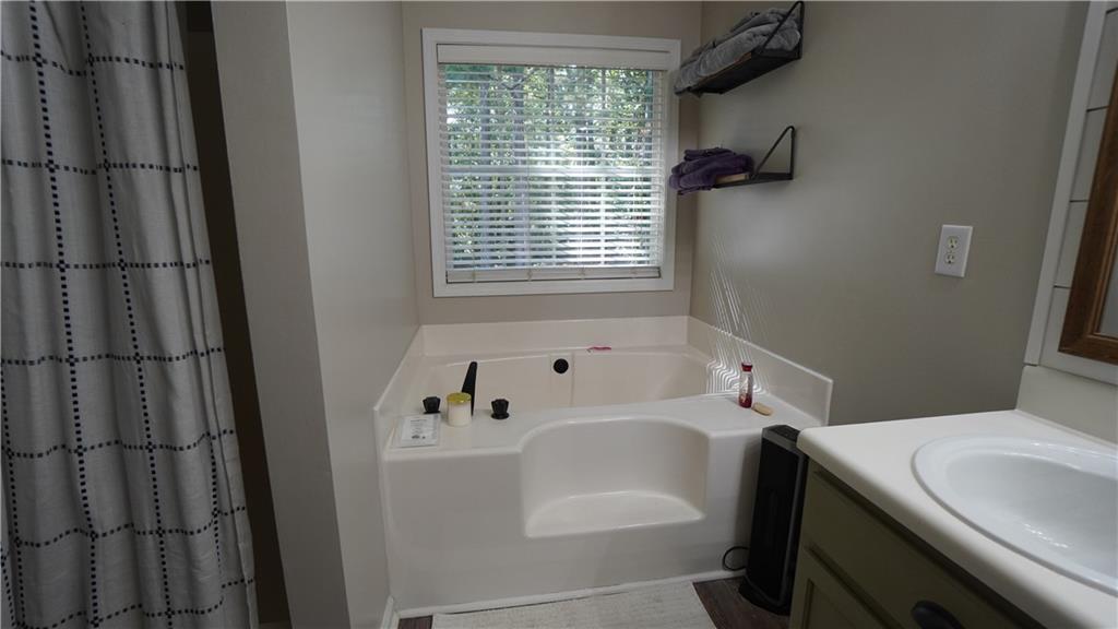 138 West Fork Way Temple, GA 30179 - Photo 9 of 21 a bathroom with a bathtub and window