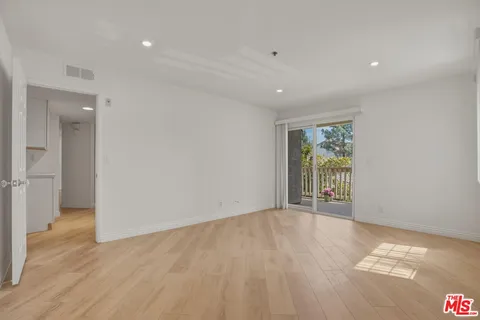 a view of a room with a large window