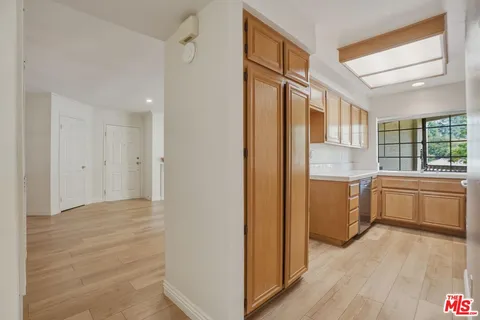 a white toilet sitting next to a bath tub