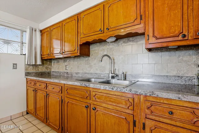 a kitchen with stainless steel appliances granite countertop a stove and a sink