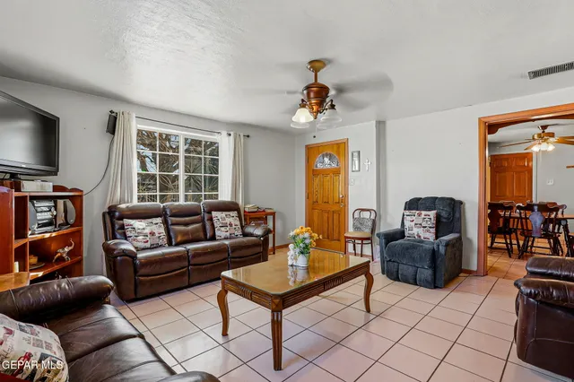 a view of a house with a snow in the yard