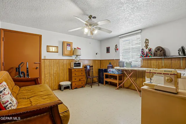 a bedroom with a bed and a table