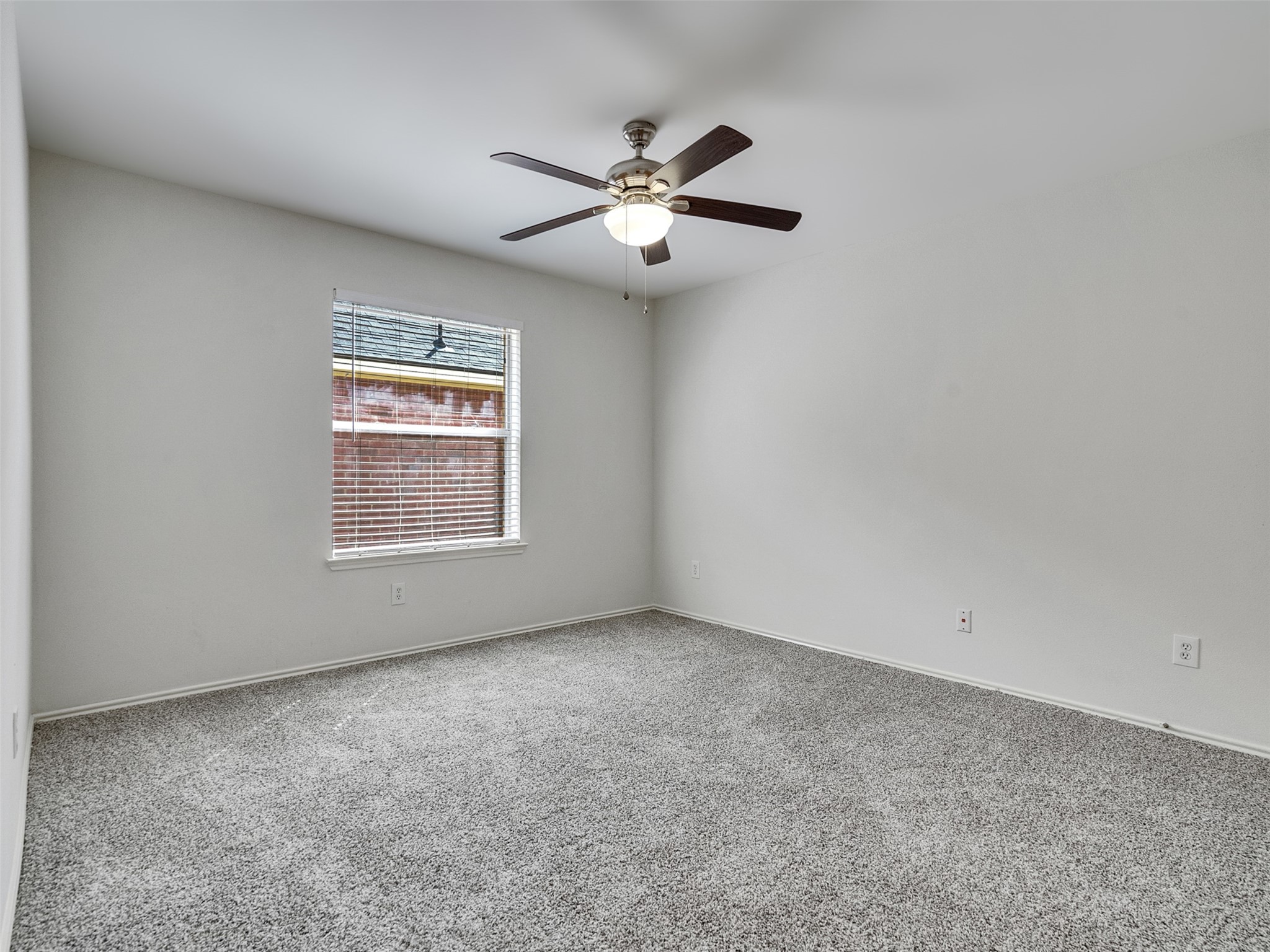 13431 Rural Oak Street Houston, TX 77034 - Photo 16 of 24 an empty room with a window and a fan
