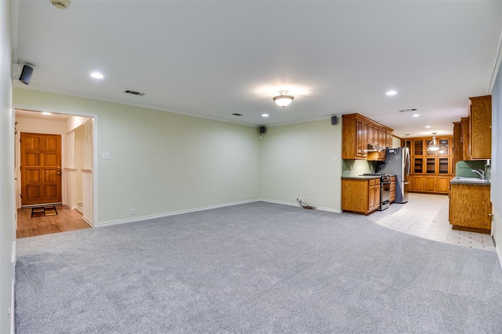 802 Cardinal Road Mansfield, TX 76063 - Photo 13 of 31 Unfurnished living room featuring recessed lighting, light colored carpet, and ornamental molding