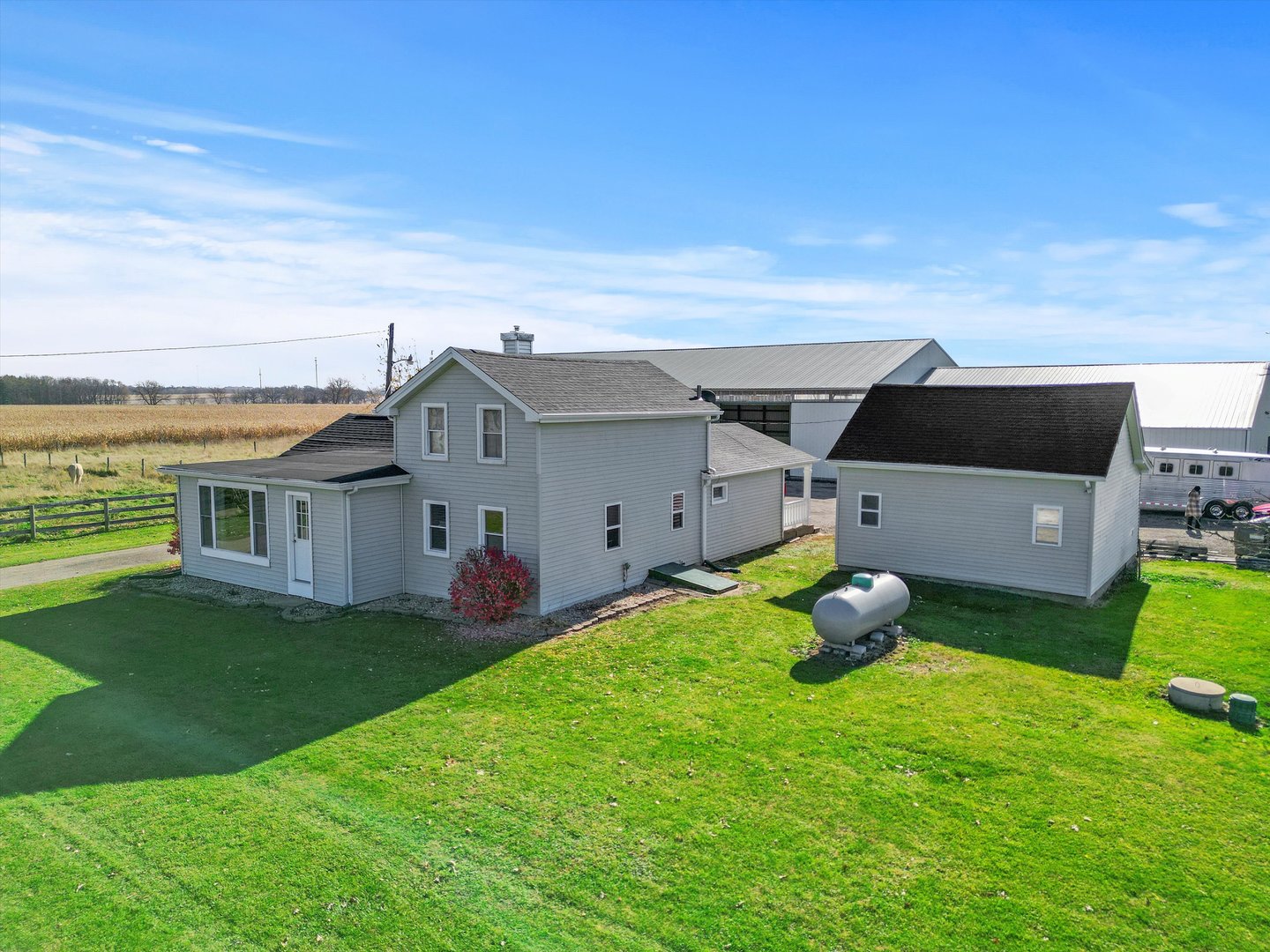 8807 North Boone School Road Capron, IL 61012 - Photo 4 of 35 a view of a house with a backyard and a patio