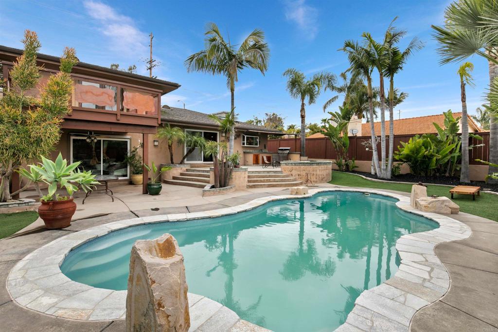 a view of a swimming pool with a patio