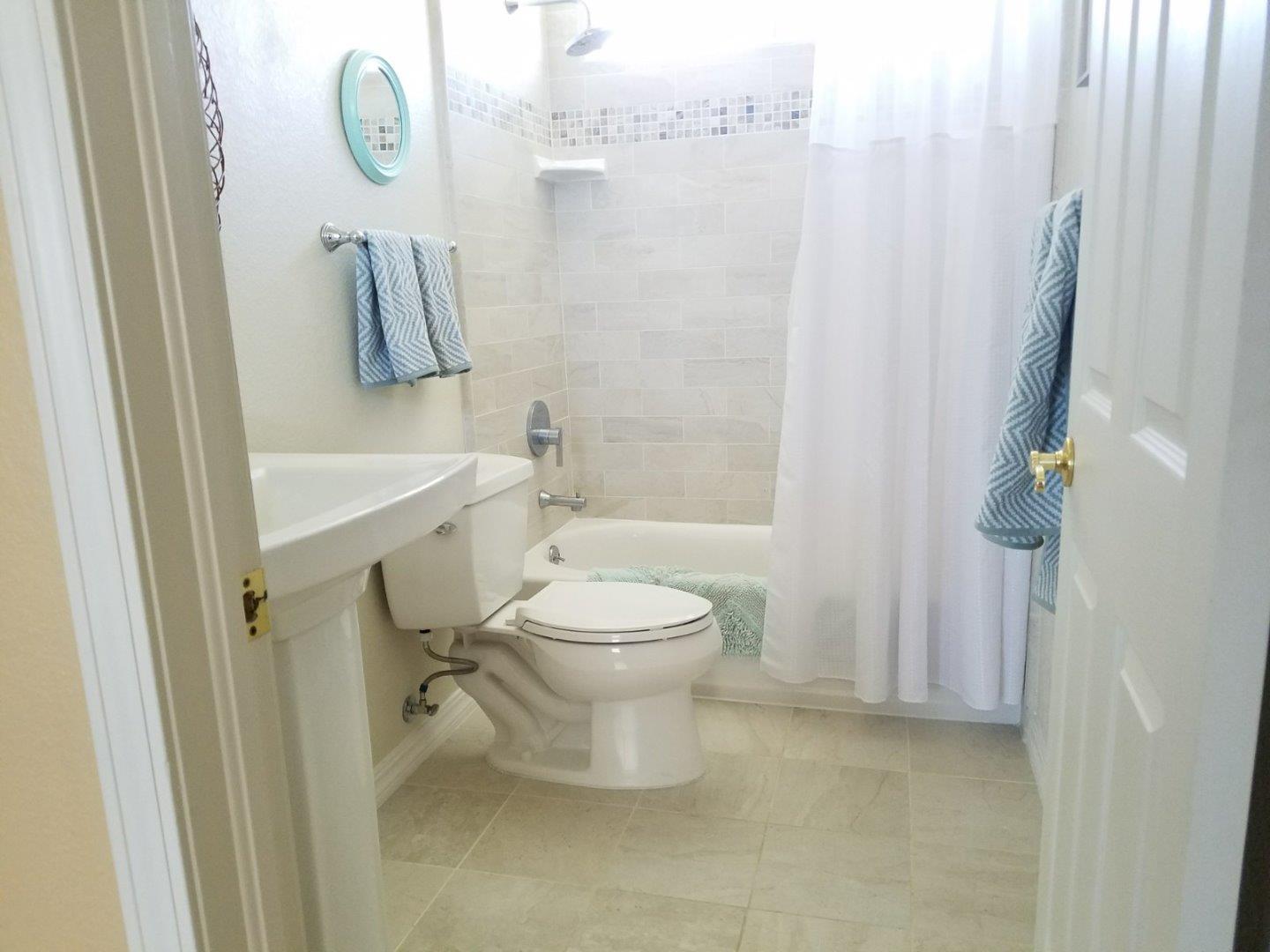 148 Greenbriar Way Salinas, CA 93907 - Photo 17 of 29 a bathroom with a toilet sink vanity and shower