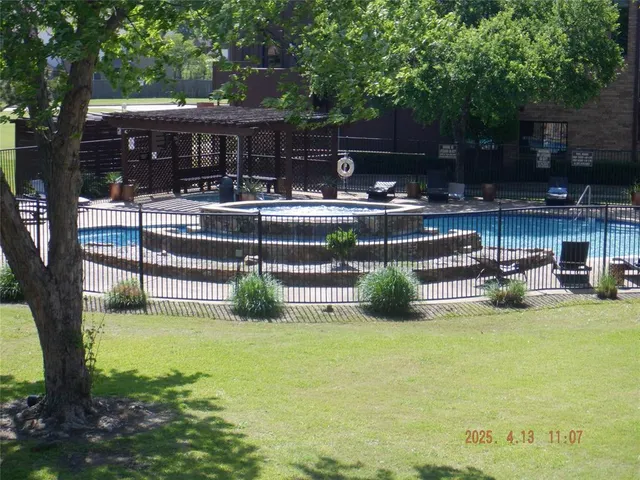 a view of swimming pool with patio