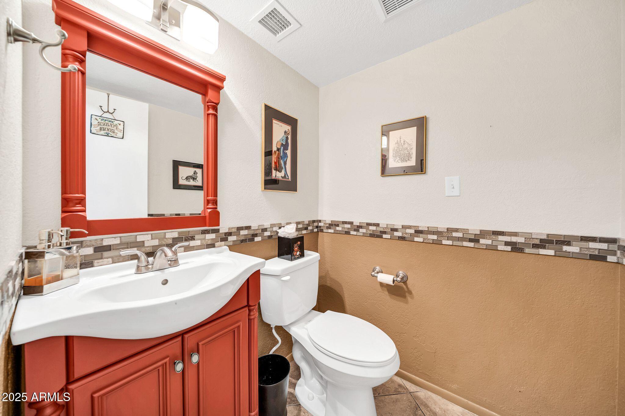 25621 Cordova Lane Rio Verde, AZ 85263 - Photo 18 of 42 a bathroom with a sink mirror vanity and toilet